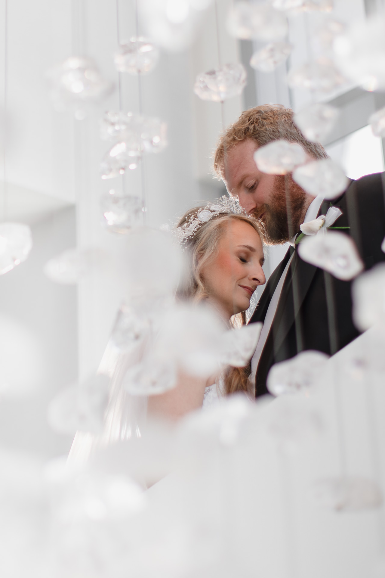 A Denver hotel wedding photo with the bride and groom embracing.