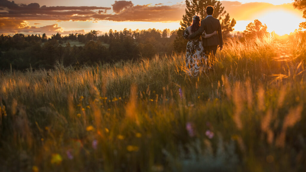 Denver Wedding Couple walking at sunset.